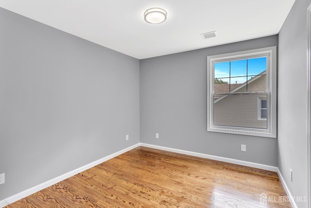 65 Bayview St, Aberdeen, NJ 07721 - empty room with wood finished floors and baseboards