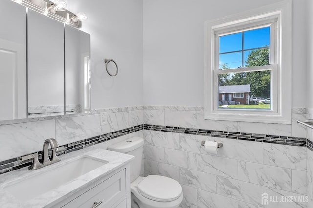 65 Bayview St, Aberdeen, NJ 07721 - bathroom featuring vanity, a wainscoted wall, and tile walls