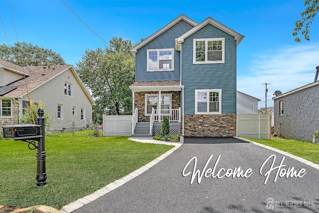 65 Bayview St, Aberdeen, NJ 07721 - view of front of property with stone siding and covered porch