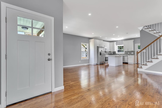 65 Bayview St, Aberdeen, NJ 07721 - foyer featuring stairs, healthy amount of natural light, light wood-style floors, and recessed lighting