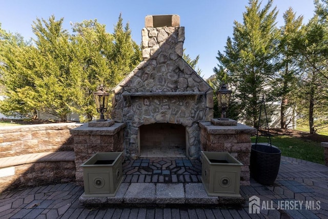45 Imperial Ct, Monroe, NJ 08831 - view of patio featuring an outdoor stone fireplace