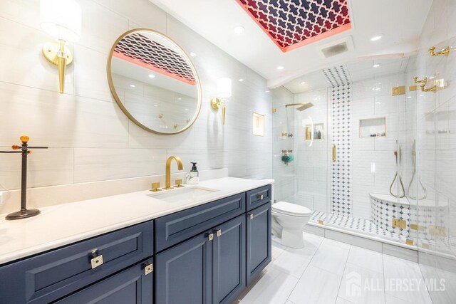 45 Imperial Ct, Monroe, NJ 08831 - full bathroom with vanity, toilet, a shower stall, tile walls, and tile patterned flooring