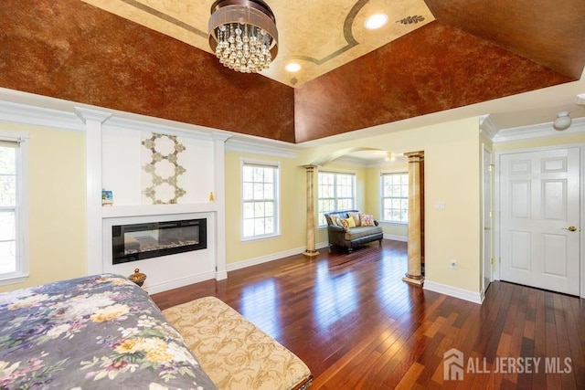 45 Imperial Ct, Monroe, NJ 08831 - bedroom with arched walkways, hardwood / wood-style floors, decorative columns, a glass covered fireplace, and baseboards