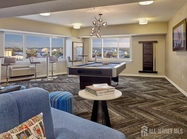 game room with dark carpet, pool table, an AC wall unit, and baseboards