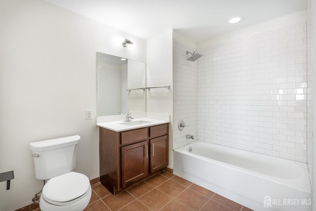 full bath featuring tile patterned flooring, bathing tub / shower combination, toilet, and vanity