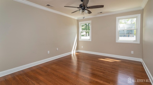 unfurnished room with baseboards, dark wood finished floors, ornamental molding, and a ceiling fan