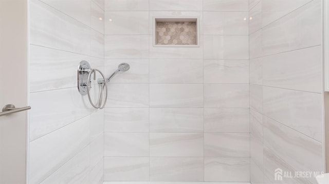bathroom view of tiled shower