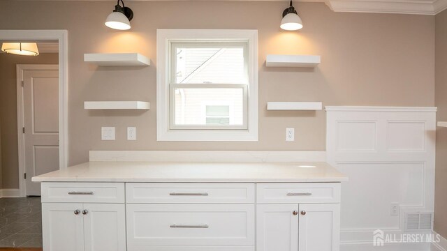 bathroom featuring vanity and crown molding