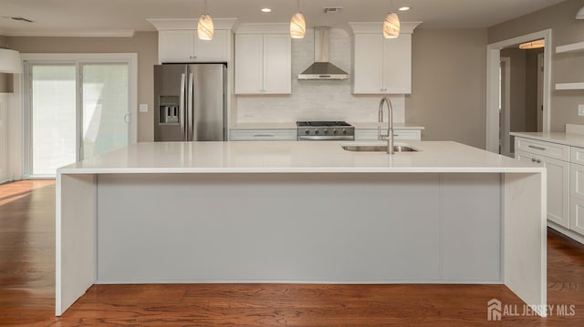 kitchen with stainless steel fridge with ice dispenser, wall chimney exhaust hood, a sink, stove, and light countertops