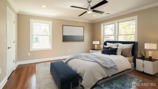 bedroom with wood finished floors, ornamental molding, baseboards, recessed lighting, and ceiling fan