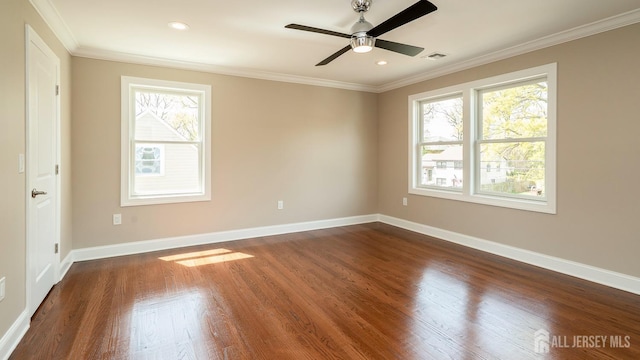 empty room with crown molding, dark wood-style floors, a ceiling fan, baseboards, and recessed lighting
