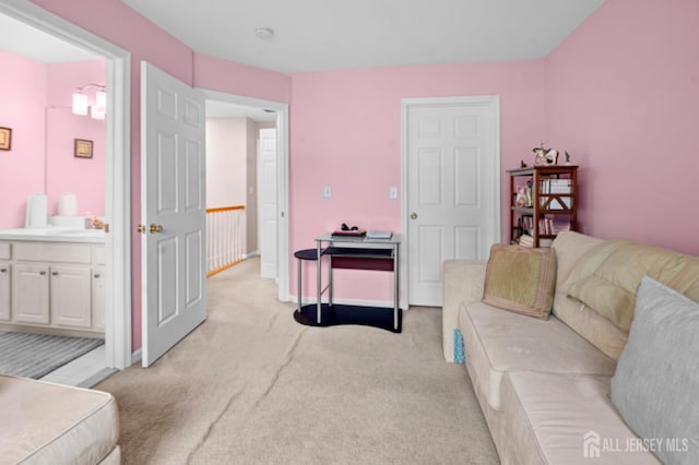 living room with light carpet and baseboards