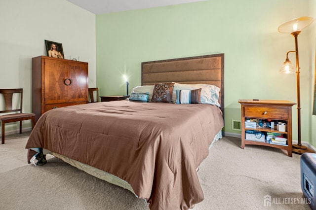 bedroom featuring carpet and baseboards