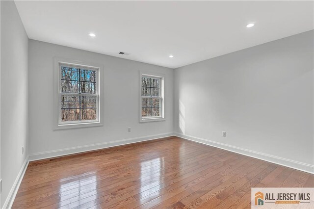 spare room with light wood-type flooring