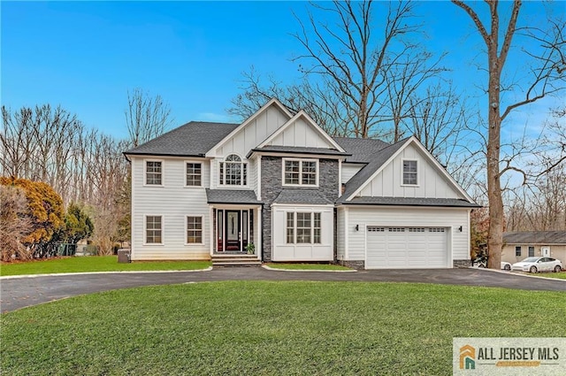 view of front of house featuring stone siding, aphalt driveway, an attached garage, board and batten siding, and a front yard