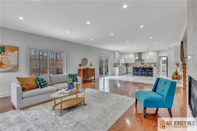 living room featuring plenty of natural light and light wood-type flooring