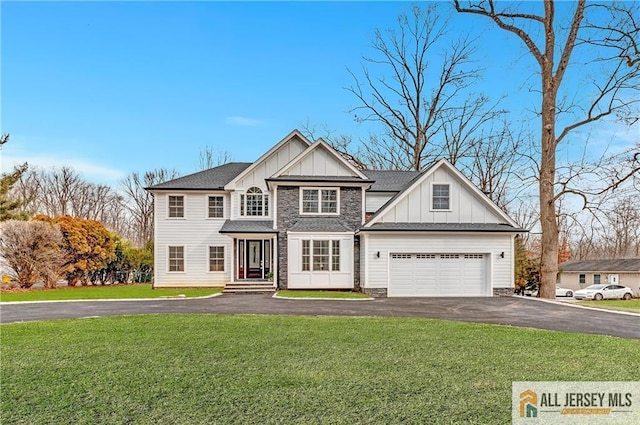 view of front of house with a garage and a front yard