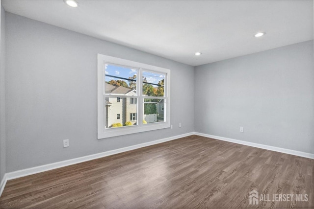 empty room featuring dark hardwood / wood-style floors