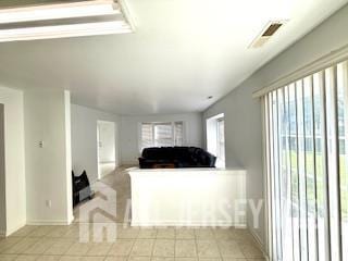 284 Brookfield Dr, Jackson, NJ 08527 - living room featuring light tile patterned floors and baseboards
