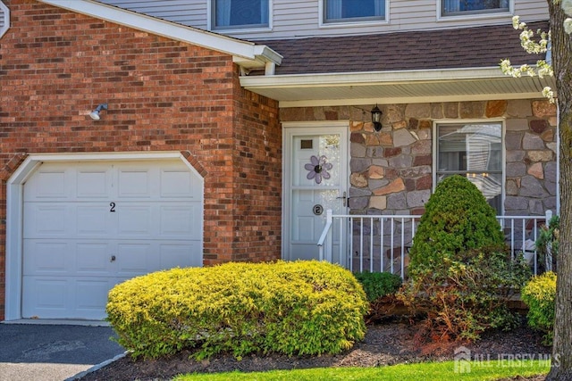 675 Raritan Rd, Clark, NJ 07066 - entrance to property with a shingled roof and brick siding