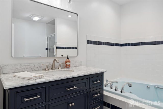 675 Raritan Rd, Clark, NJ 07066 - full bath featuring vanity, a whirlpool tub, and a stall shower