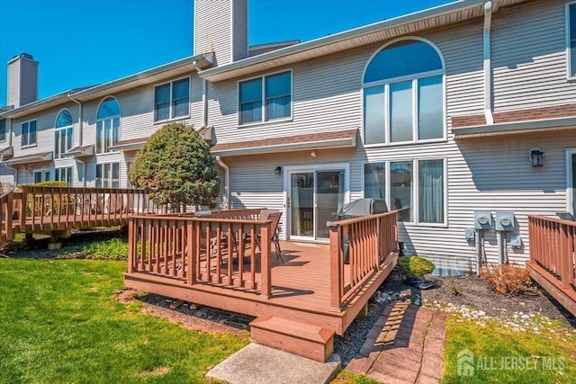 675 Raritan Rd, Clark, NJ 07066 - rear view of property with a chimney, a deck, and a yard