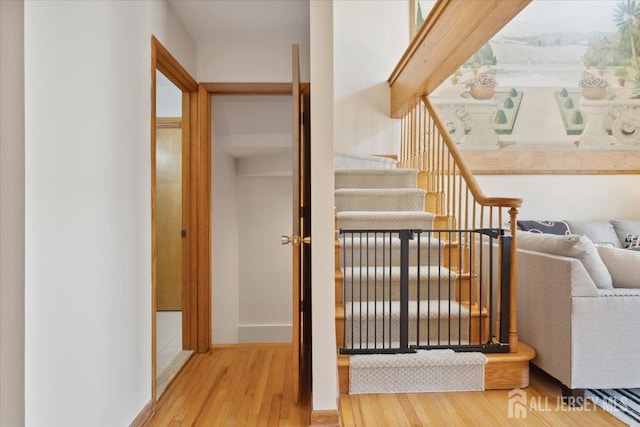 675 Raritan Rd, Clark, NJ 07066 - stairs with hardwood / wood-style floors and baseboards