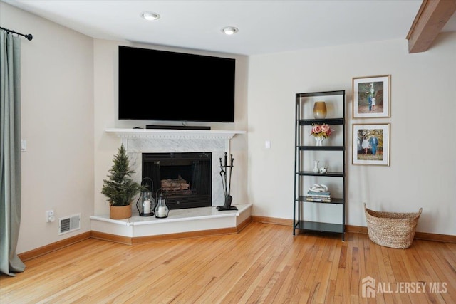 675 Raritan Rd, Clark, NJ 07066 - living area with wood finished floors, a fireplace, baseboards, and recessed lighting
