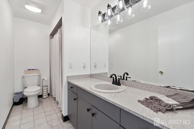 675 Raritan Rd, Clark, NJ 07066 - full bathroom featuring vanity, toilet, and tile patterned floors