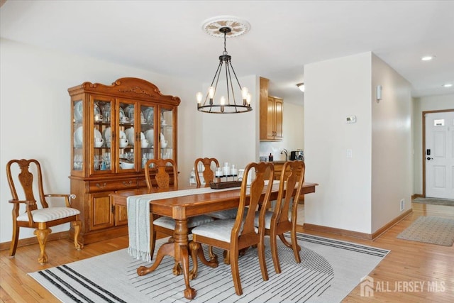 675 Raritan Rd, Clark, NJ 07066 - dining space featuring a chandelier, light wood-type flooring, baseboards, and recessed lighting