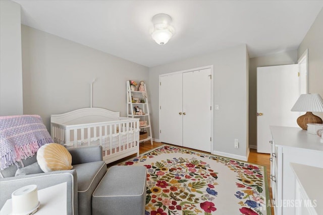 675 Raritan Rd, Clark, NJ 07066 - bedroom featuring light wood-type flooring, baseboards, and a closet