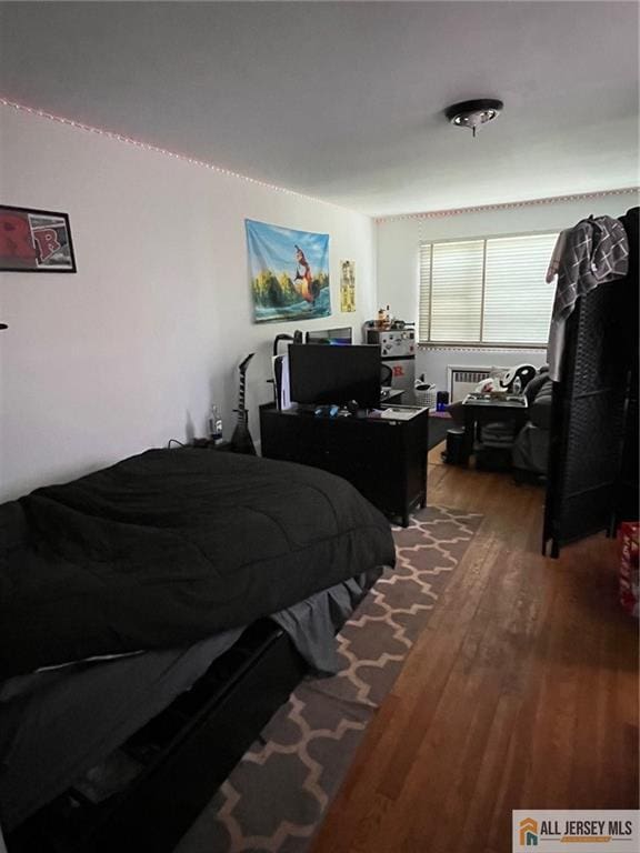 bedroom with wood finished floors