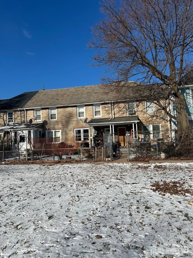 view of snow covered house