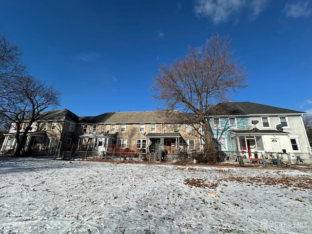 view of snow covered house