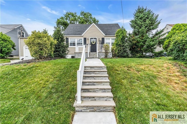 11 Donna St, East Brunswick, NJ 08816 - view of front of home featuring a front lawn and a shingled roof