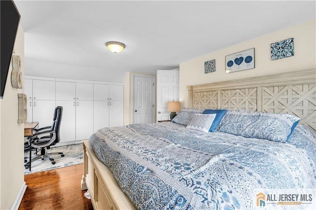 11 Donna St, East Brunswick, NJ 08816 - bedroom featuring dark wood-style flooring, a closet, and a desk