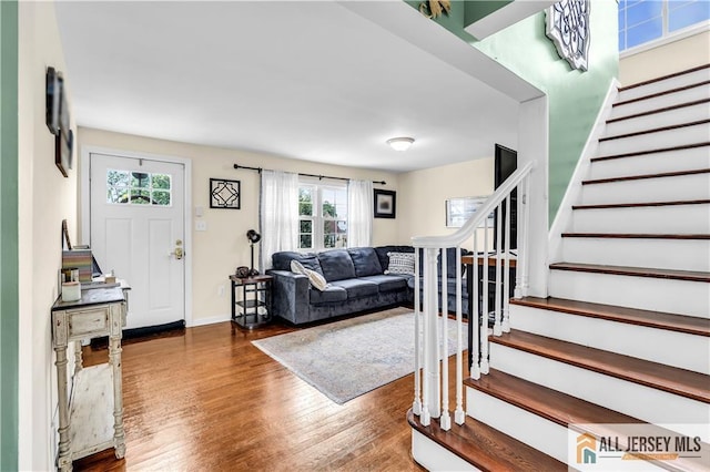 11 Donna St, East Brunswick, NJ 08816 - foyer entrance with stairway, wood finished floors, and healthy amount of natural light