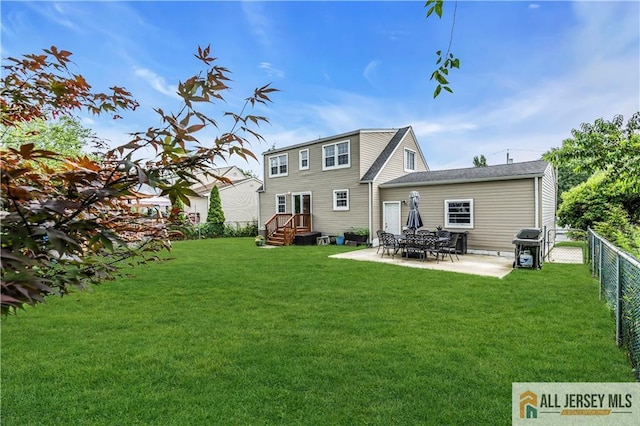 11 Donna St, East Brunswick, NJ 08816 - back of property featuring a fenced backyard and a patio area