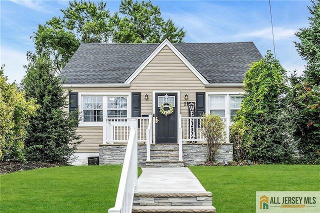 11 Donna St, East Brunswick, NJ 08816 - view of front of house featuring a front lawn and a shingled roof