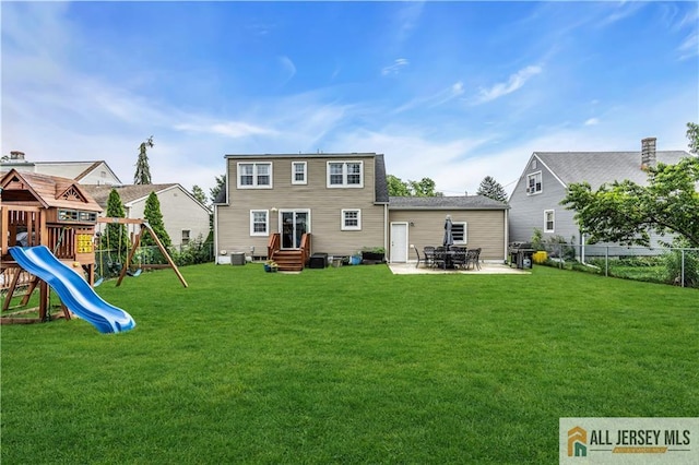 11 Donna St, East Brunswick, NJ 08816 - back of house featuring entry steps, a playground, and a patio
