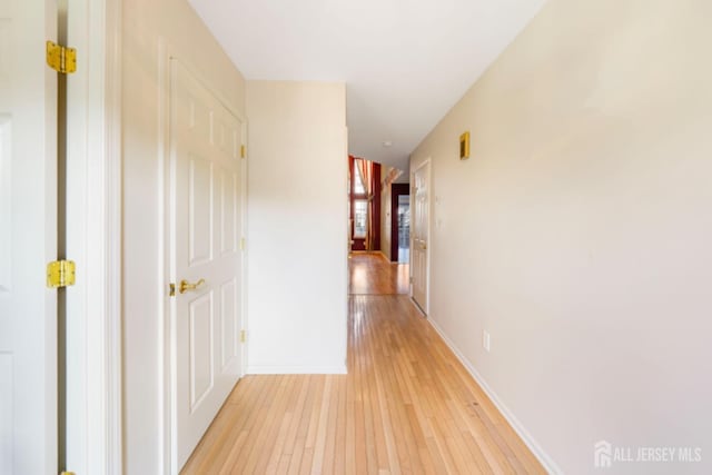 corridor featuring light hardwood / wood-style floors