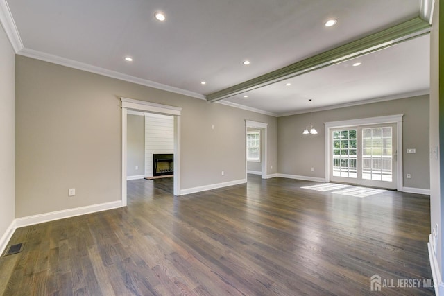 empty room featuring crown molding, dark wood-type flooring, and beamed ceiling