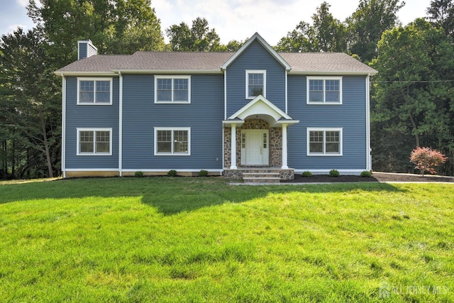 colonial home with a front yard