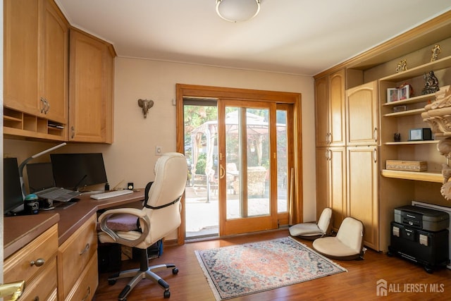 office area with hardwood / wood-style floors and french doors