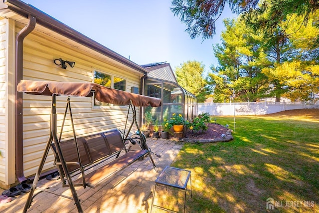 view of yard with a sunroom