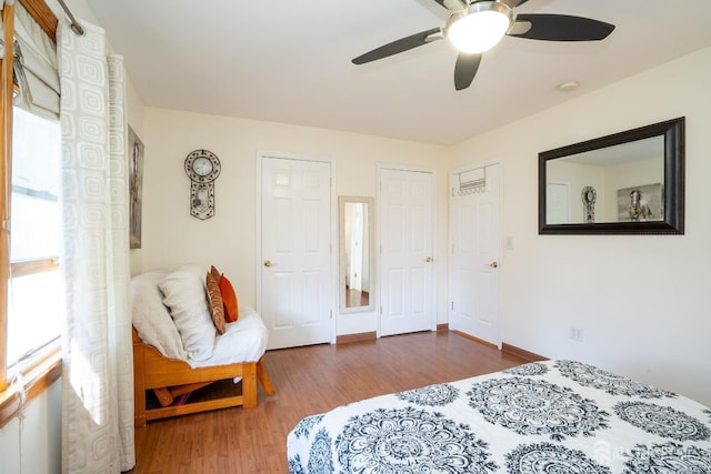 bedroom with wood-type flooring and ceiling fan