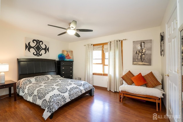 bedroom featuring dark hardwood / wood-style floors and ceiling fan