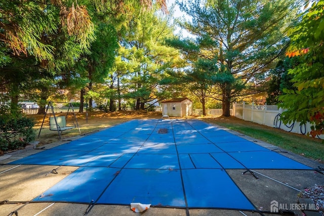 view of pool with a storage unit