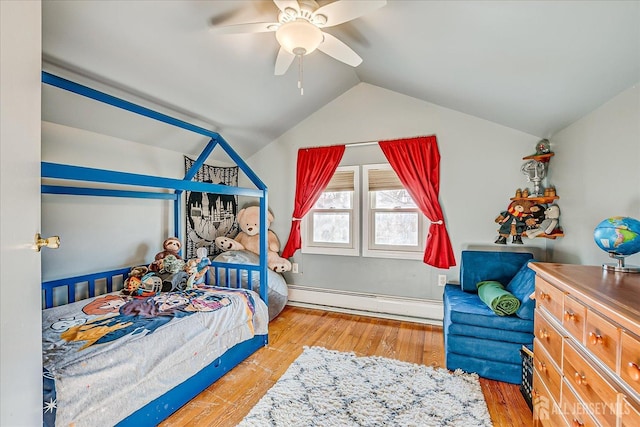 bedroom with ceiling fan, light wood-type flooring, vaulted ceiling, and a baseboard radiator