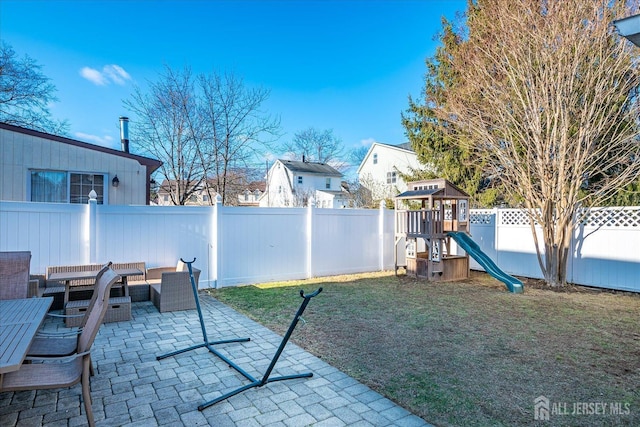 view of patio featuring an outdoor hangout area and a playground